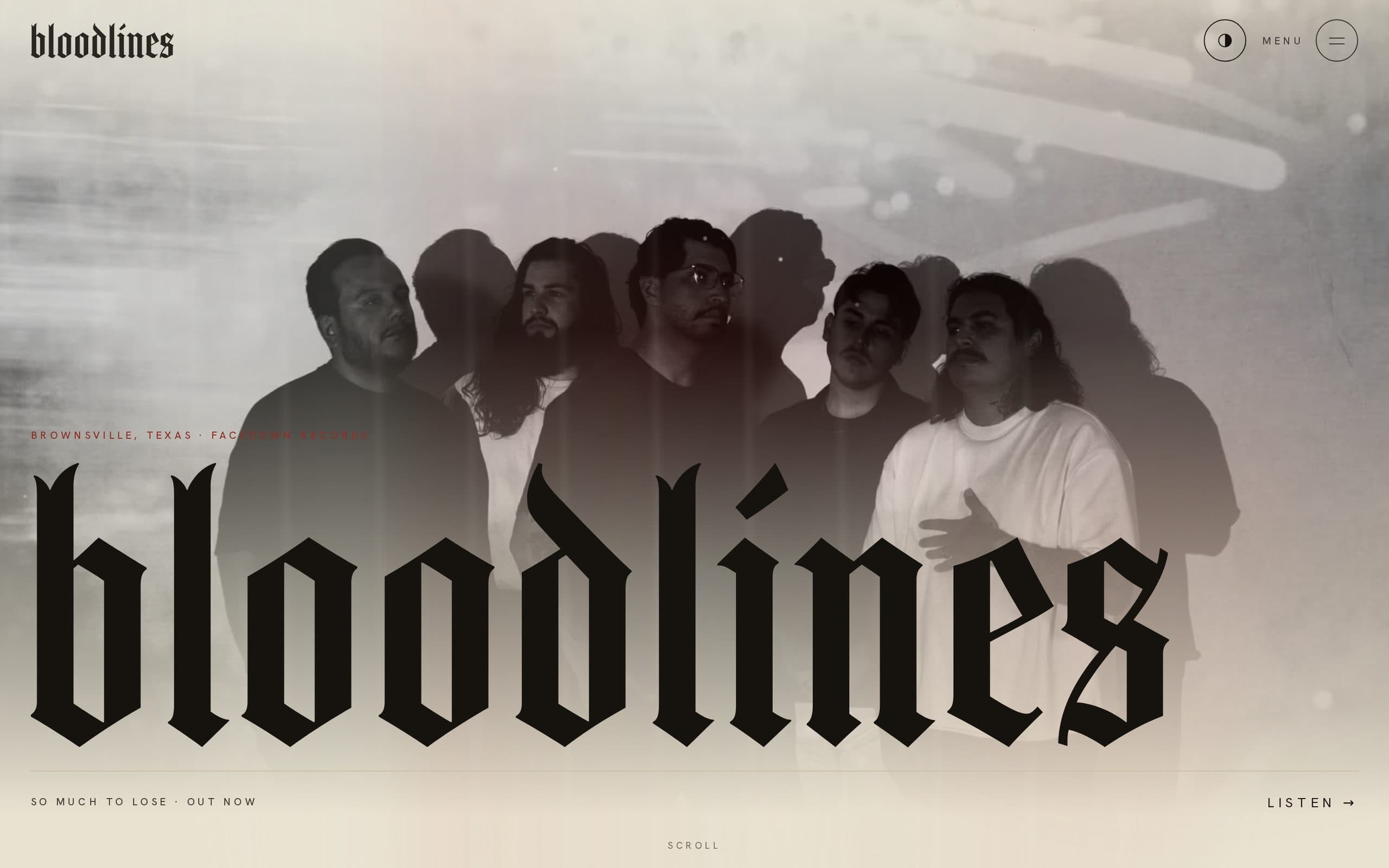 The home page in the light theme: the band photograph on pale bone, with the blackletter logo in black.
