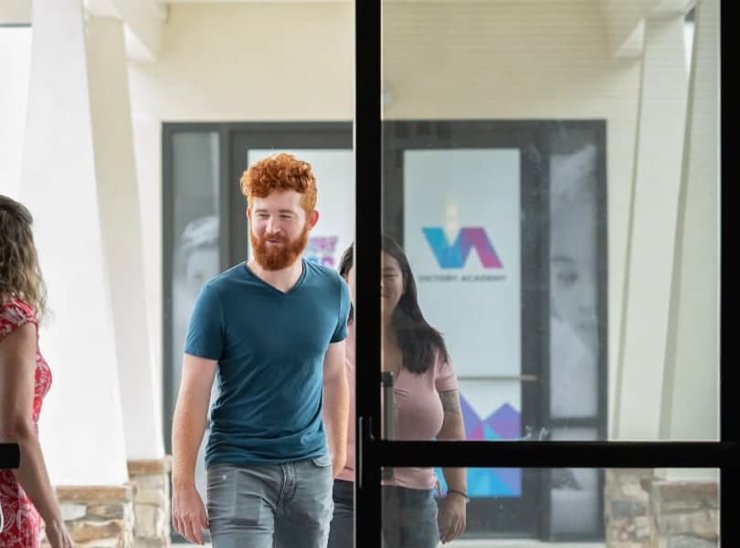 Guests coming through Victory Church’s glass front doors.